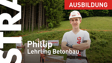 Lehrling steht vor Baustelle